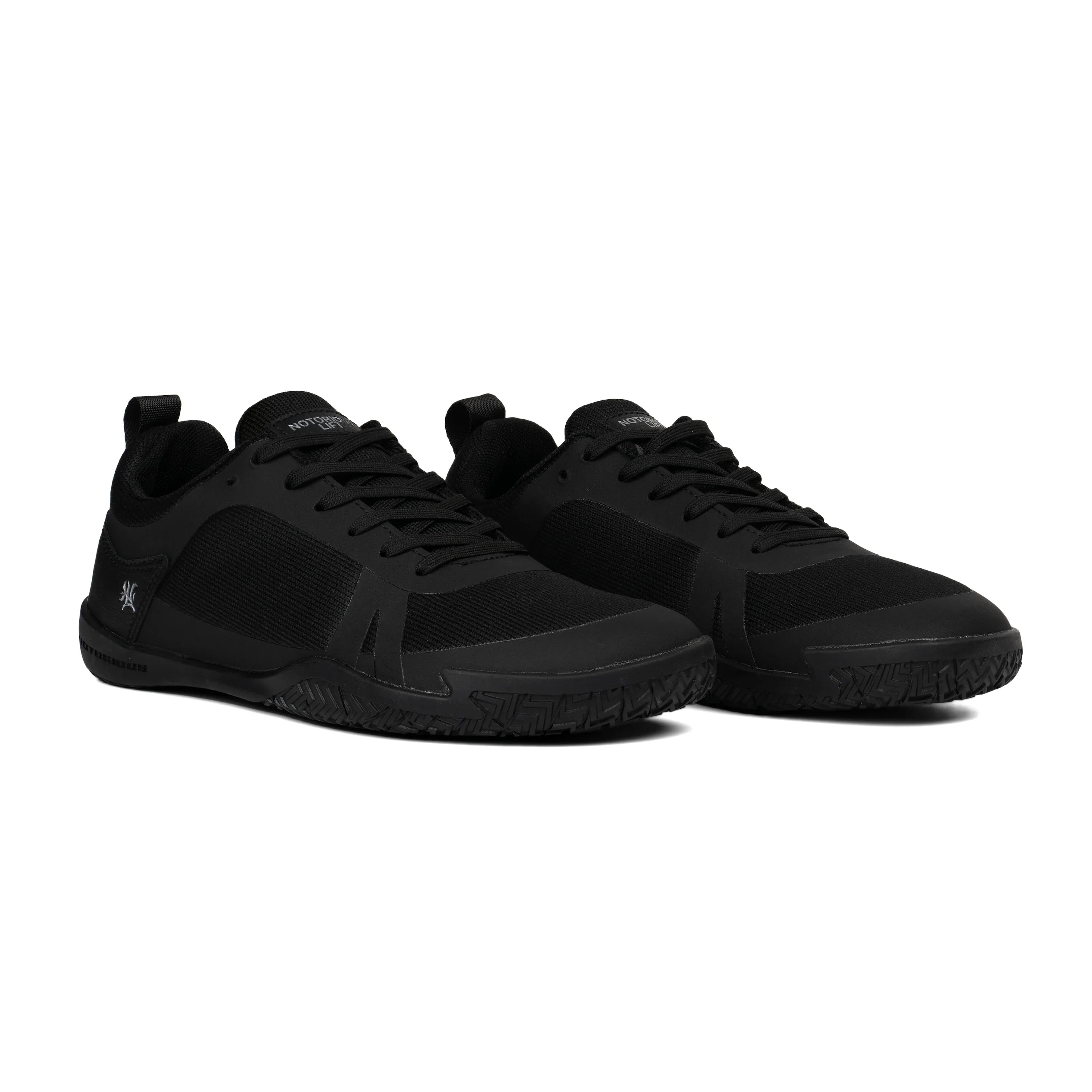 Radix black barefoot training shoe angled view - flexible rubber outsole, lightweight mesh upper